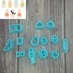 May include: A collection of blue plastic Halloween-themed cookie cutters in various shapes, including pumpkins, ghosts, bats, and a skeleton. The image also shows examples of cookies made with the cutters.