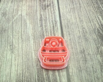 Polaroid camera polymer clay cutter, sharp edge, retro, photograph