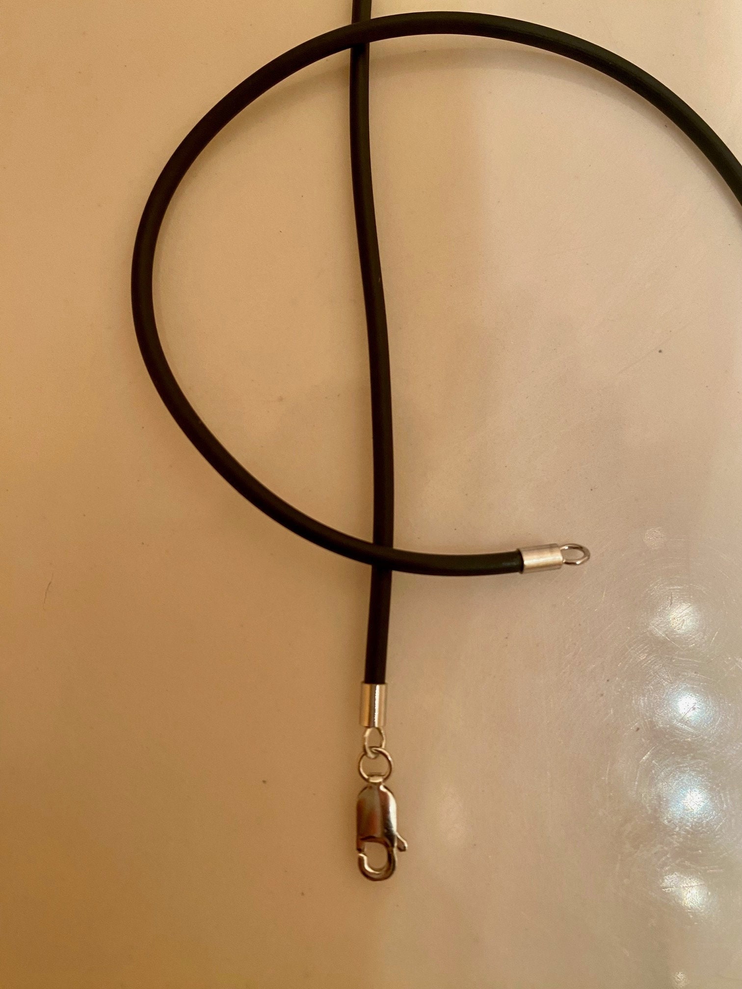 Rubber necklace cord with shop gold clasp