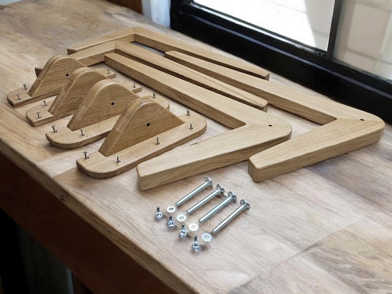 May include: Four unfinished wooden legs for a piece of furniture, with screws and nuts for assembly.