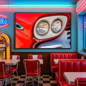May include: A framed print of a classic red car's front end, showcasing headlights and chrome details. The image hangs in a retro diner with red booths, chrome chairs, and a black and white checkered floor. Neon signs add to the vintage ambiance.