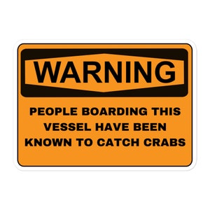 May include: A yellow warning sign with black text that reads "WARNING" in a black diamond shape. The text below reads "PEOPLE BOARDING THIS VESSEL HAVE BEEN KNOWN TO CATCH CRABS."