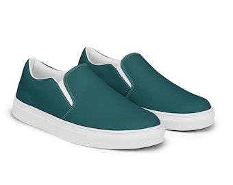 Może przedstawiać: Para tealowych płóciennych butów typu slip-on z białymi podeszwami.