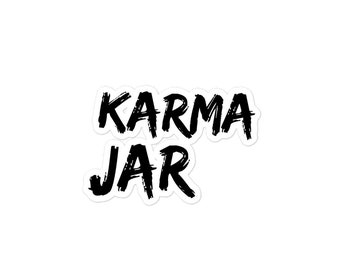 May include: Black and white sticker with the text "KARMA JAR" in a bold, brush-stroke font.
