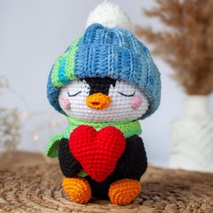Little penguin with heart. Valentine Penguin