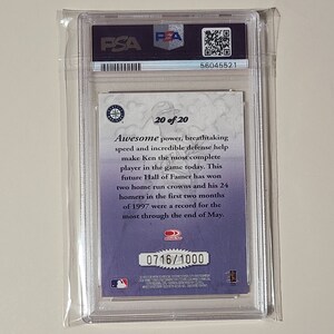 May include: A graded baseball card featuring Ken Griffey Jr. in a Seattle Mariners uniform. The card is numbered 0716/1000 and is part of a 20-card set. The back of the card features a description of Griffey's career highlights.