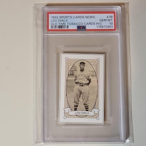 May include: A vintage baseball card featuring Lou Dials of the American Giants, encased in a protective holder. The card is from the 1992 Sports Cards News series, graded GEM MT 10. The card has a sepia tone and includes the text "LOU DIALS".