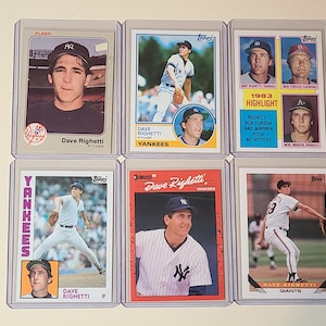 May include: A collection of six baseball cards featuring Dave Righetti in various poses. The cards showcase Righetti in a Yankees uniform and a Giants uniform. The cards are in protective sleeves and include the text "Dave Righetti" and "Yankees".