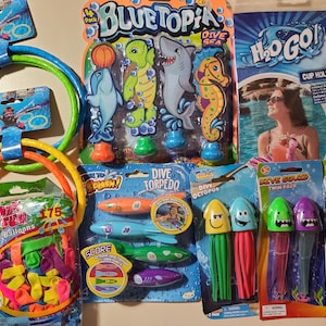 May include: A collection of pool toys including a set of three dive rings, a set of water balloons, a set of dive torpedoes, a set of dive octopus, a set of dive squid, and a cup holder. The toys are all themed with ocean animals and have bright colors.