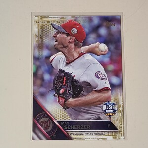 May include: A 2016 Topps baseball card featuring Max Scherzer of the Washington Nationals in a grey uniform and red cap, throwing a baseball. The card includes the text Max Scherzer, Washington Nationals, and 2016 All-Star Game logo.