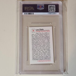 May include: A baseball card encased in a clear plastic holder. The card features text about Lou Dials, a baseball player for the Chicago American Giants. The card is graded by PSA and has a serial number.