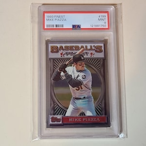 May include: A graded 1993 Finest Mike Piazza baseball card in a protective case. The card shows a player image and the text "Baseball's Finest". The top of the case has the text "1993 Finest Mike Piazza".