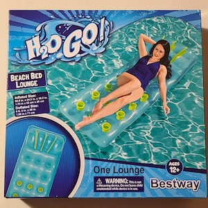 May include: A blue and green inflatable lounge chair with the text "H₂O GO!" and "Beach Bed Lounge" on the box. The box also includes the text "One Lounge" and "Bestway".