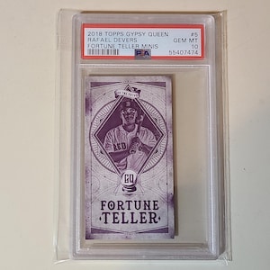 May include: A baseball card encased in a protective holder. The card features Rafael Devers from the 2018 Topps Gypsy Queen series, labeled as a "Fortune Teller Minis" card. The card is graded as GEM MT 10.