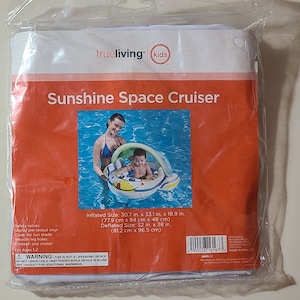 May include: A white and yellow inflatable pool float shaped like a spaceship with a canopy. The float has a smiling cartoon face and is designed for a child. The float is in a pool with a woman and child inside. The packaging says "Sunshine Space Cruiser" and includes the dimensions of the float when inflated and deflated.