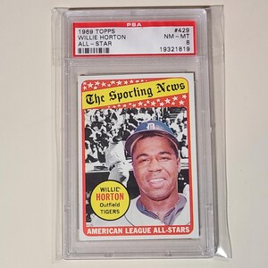 May include: A 1969 Topps baseball card featuring Willie Horton, an outfielder for the Detroit Tigers. The card is graded NM-MT 8 by PSA and has the number 429. The card features a photo of Horton in his Tigers uniform, with the text "The Sporting News" at the top and "Willie Horton, Outfield, Tigers" below the photo.