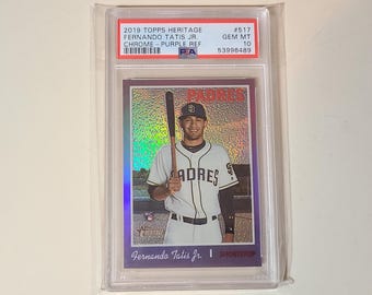 May include: A 2019 Topps Heritage Fernando Tatis Jr. Chrome Purple Refractor baseball card, graded PSA Gem Mt 10. The card features a player in a white Padres uniform holding a bat, with a holographic finish and the text Padres and Shortstop.