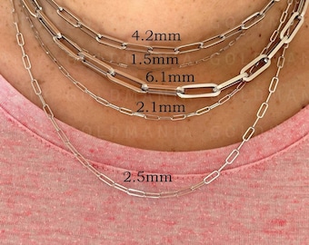 May include: Five silver chain necklaces of different widths, layered on a person's neck. The chains are labeled with their widths in millimeters: 2.5mm, 2.1mm, 6.1mm, 1.5mm, and 4.2mm.