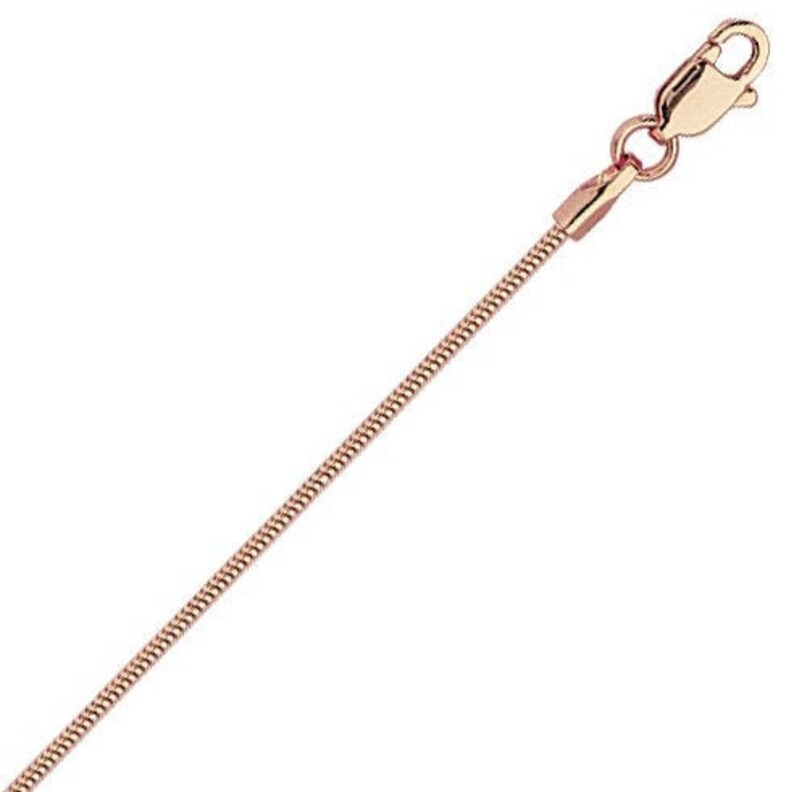 May include: A rose gold snake chain necklace with a lobster clasp.