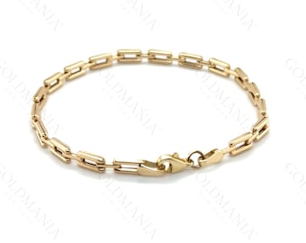 May include: A gold chain bracelet with a box chain design. The bracelet has a lobster clasp closure.