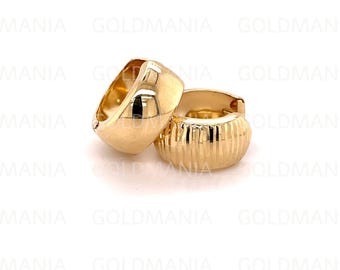 May include: A pair of gold hoop earrings. One earring has a smooth, rounded surface, while the other has a textured, ridged surface.