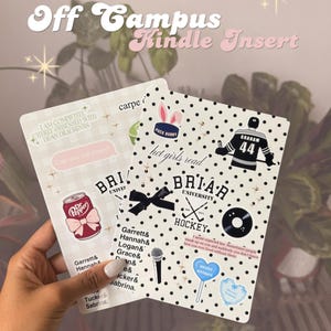 May include: Two Kindle inserts with decorative designs. One features a Dr. Pepper can sticker and text, the other has a hockey player graphic and the words "hot girls read." Both have a university theme.