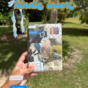 May include: A Kindle insert with a collage design. The design includes images of a football player with the number 13, hearts, books, and text. The text includes "Hi, Shannon" and "Hi, Johnny". The background is a blurred outdoor scene.