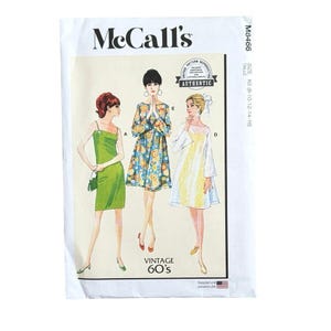 May include: A vintage McCall's sewing pattern envelope featuring illustrations of three dresses from the 1960s. The dresses are in green, floral print, and white with yellow accents. The envelope has the text "McCall's" and "Vintage 60's".