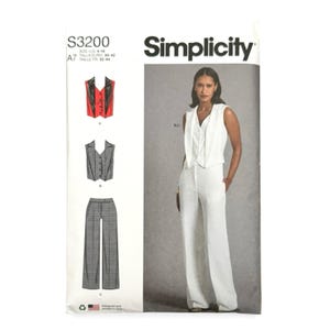 May include: Simplicity sewing pattern S3200 featuring a woman in a white vest and pants suit. The pattern includes illustrations of a red and black vest, a gray vest, and gray plaid pants. The pattern size is US 4-16.