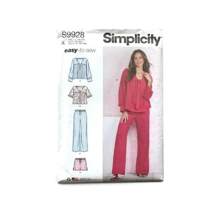 May include: Simplicity sewing pattern S9928 for an easy-to-sew top and pants set. The package displays illustrations of four garment variations including a long-sleeve blouse, a short-sleeve top, long trousers, and shorts, plus a photo of the finished outfit.