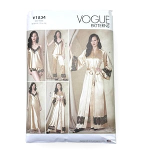 May include: Vogue Patterns V1834 sewing pattern envelope featuring illustrations of champagne-colored satin sleepwear sets. Designs include a camisole, shorts, long pants, a floor-length gown, and a long robe, all accented with black lace trim.