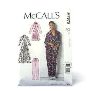 May include: McCall's M7875 sewing pattern envelope for lounge wear. The front displays illustrations of a robe and pajamas, alongside a photograph of a person wearing a dark purple floral pajama set with white piping and a matching tie belt.