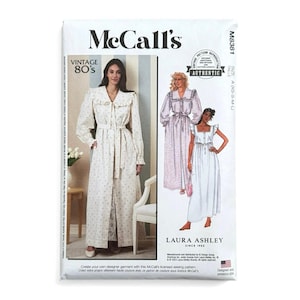 May include: A McCall's M8381 sewing pattern envelope for a Laura Ashley vintage 80s style dress. The front features a photograph of a long-sleeved floral dress with a ruffled collar and a tie waist, alongside illustrations of two dress variations.