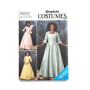 May include: Simplicity sewing pattern S9251 for costumes in sizes 14-22. The envelope features illustrations of three floor-length dresses with square necklines, three-quarter sleeves with lace trim, and full skirts in light pink, yellow, and sage green.