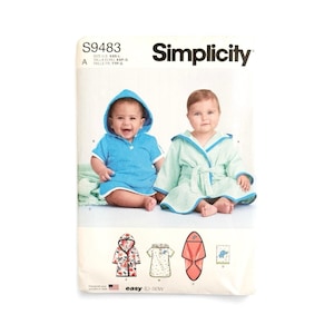 May include: Simplicity pattern S9483 for children's hooded robes and towels. The envelope features two infants wearing a blue hooded cover-up and a light green robe with blue trim. Illustrations show floral, polka dot, and solid fabric options.