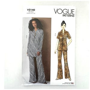 May include: Vogue Patterns V2140 sewing pattern envelope for sizes 6-14. The front displays a black and white striped tunic and wide-leg pants set, alongside a leopard print short-sleeve top and matching pants illustration with labels B, C, and A.