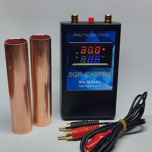 May include: A black rectangular signal generator labeled FRACTAL SOLUTION SQR-ZAPPER 1Hz-160kHz with a digital display, two gold-colored top ports, and a red button. Included are two cylindrical copper pipes and a black cable with red and black clips.