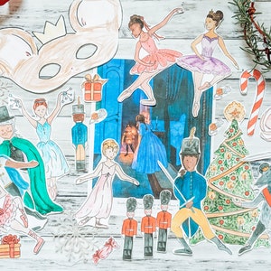 May include: A set of paper cutouts featuring characters from the Nutcracker ballet. The set includes a mouse mask, a Christmas tree, a nutcracker soldier, a ballerina, and a prince. The cutouts are colorful and detailed, and they would be perfect for a holiday craft project or a classroom activity.