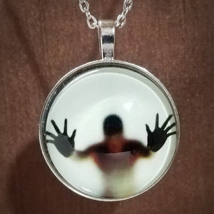 Glow in the dark trapped soul pendant, Haunted necklace