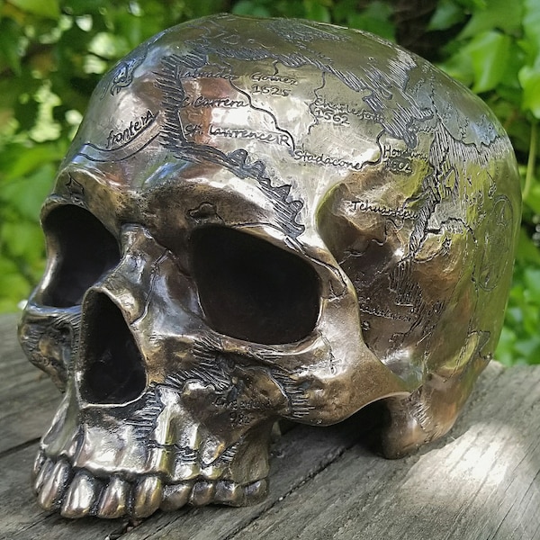 Ancient map skull, pirate treasure map, bronze human skull
