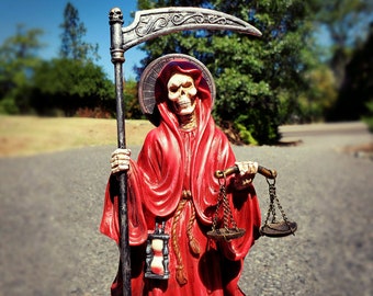 Santa Muerte statue, scales, Holy Death altar piece, reaper deity, red