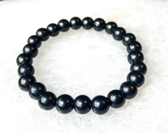 May include: A black beaded bracelet with round beads.