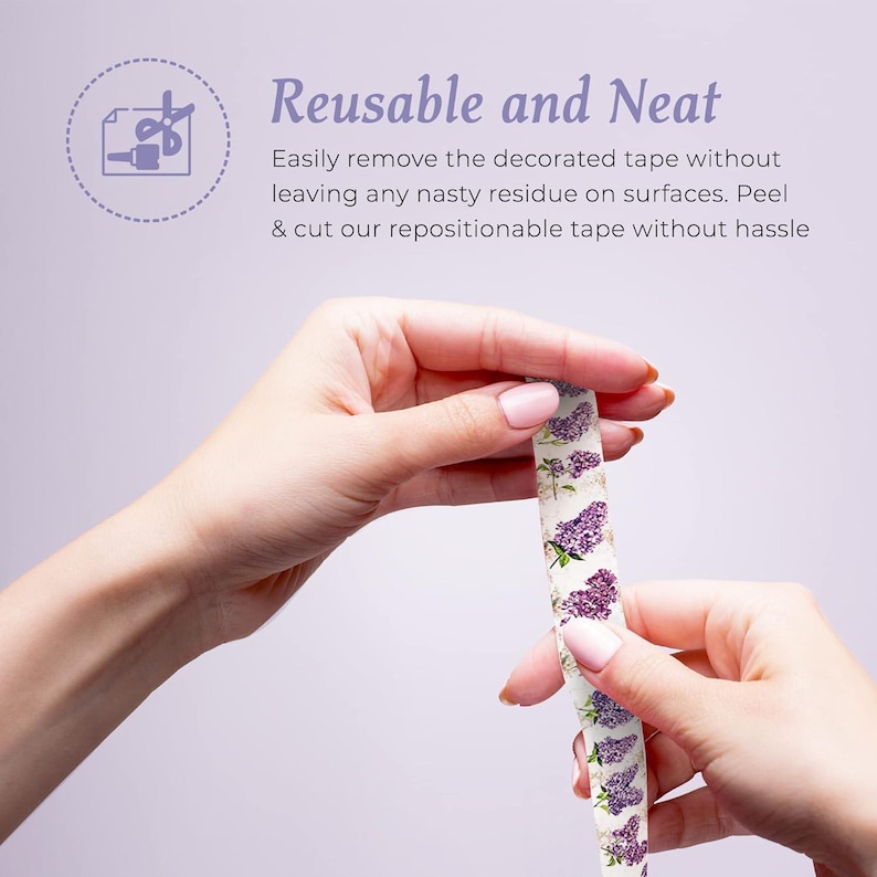 May include: A roll of repositionable tape with a floral lilac design is held between two hands. The tape is white with purple lilac flowers and green leaves. The text "Reusable and Neat" is visible in the background.