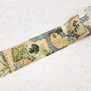 May include: Decorative washi tape featuring a vintage collage design. The tape showcases botanical illustrations, postage stamps, and ornate frames in a palette of beige, green, blue, and pink. A roll of tape is visible.