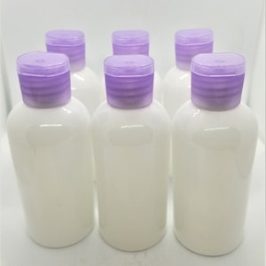 Refillable Round Bottles with Flip Top Caps - 2 oz (White). Pack of 100 bottles and cap.
