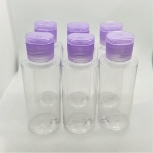Cylinder Round Refillable Bottles with Flip Top Caps - 2 oz (Clear). Pack of 6 bottles and cap.