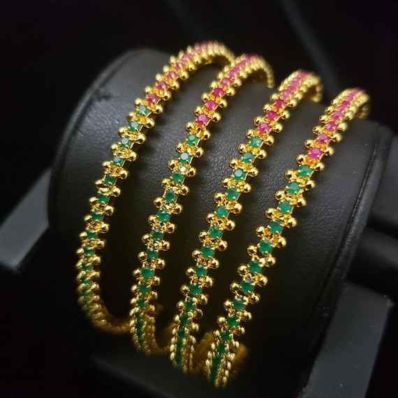 Gold bangles set of 4 best sale