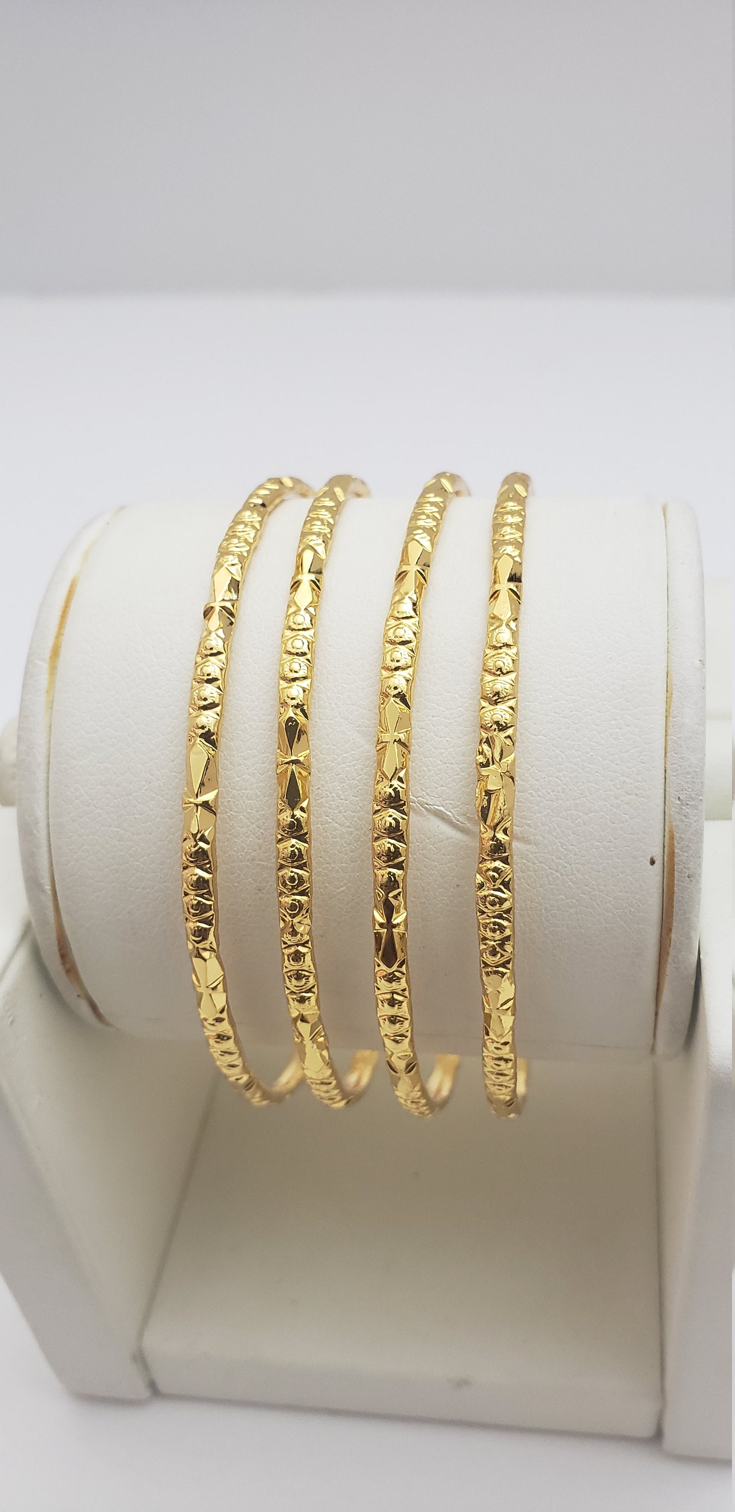 Gold bangles set of 4 outlet