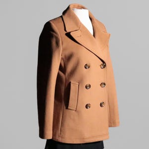May include: A brown double-breasted peacoat with six buttons.