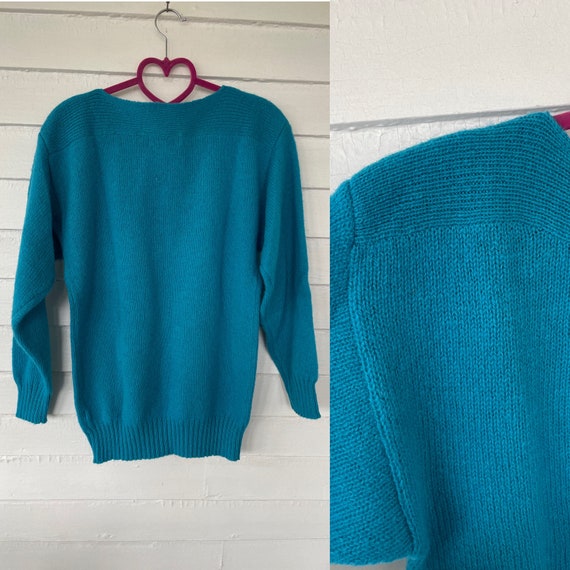 bright teal sweater